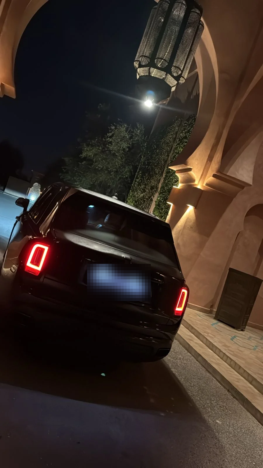Rolls-Royce outside a Moroccan palace at night